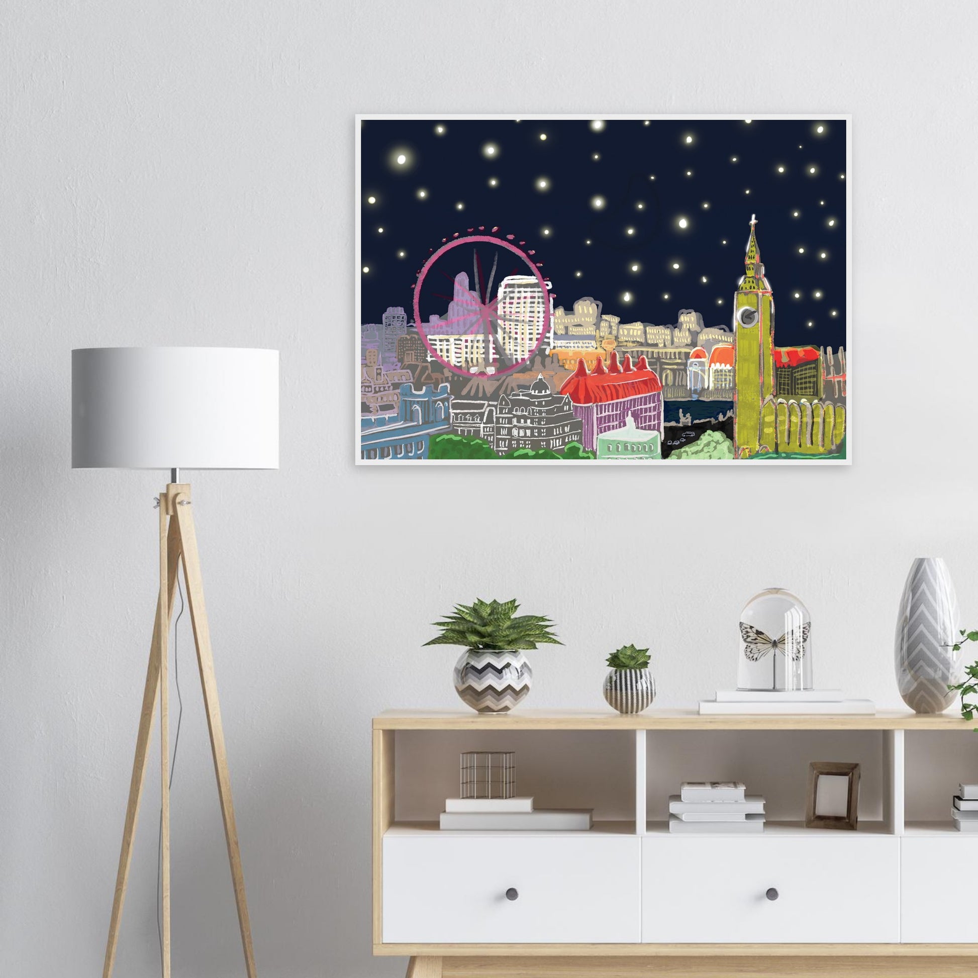 Starry London Skies art print showing iconic London landmarks under a magical starry night sky in wooden frame on white lounge wall