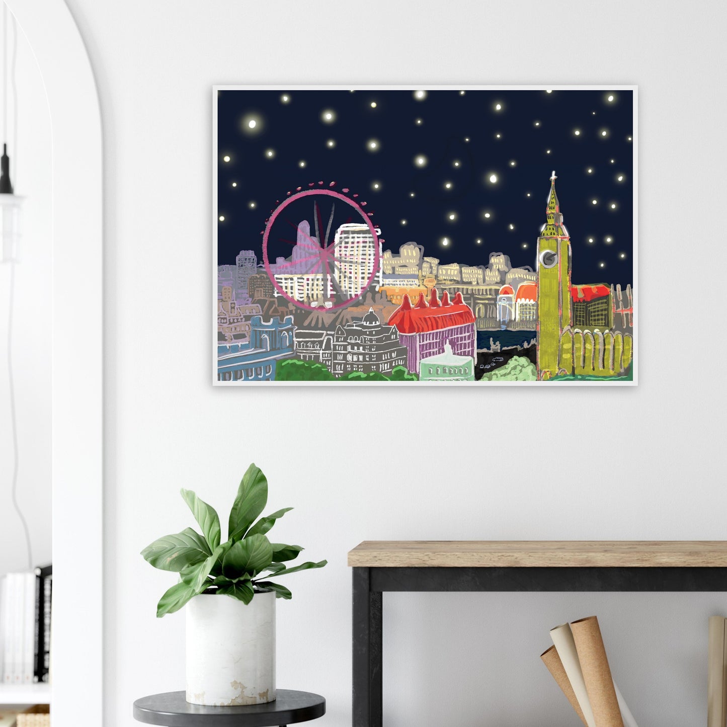 Starry London Skies art print showing iconic London landmarks under a magical starry night sky in wooden frame on white lounge wall
